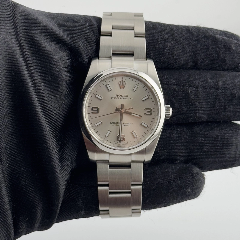 Rolex Oyster Perpetual Silver Dial on Oyster Ref. 114200 2010