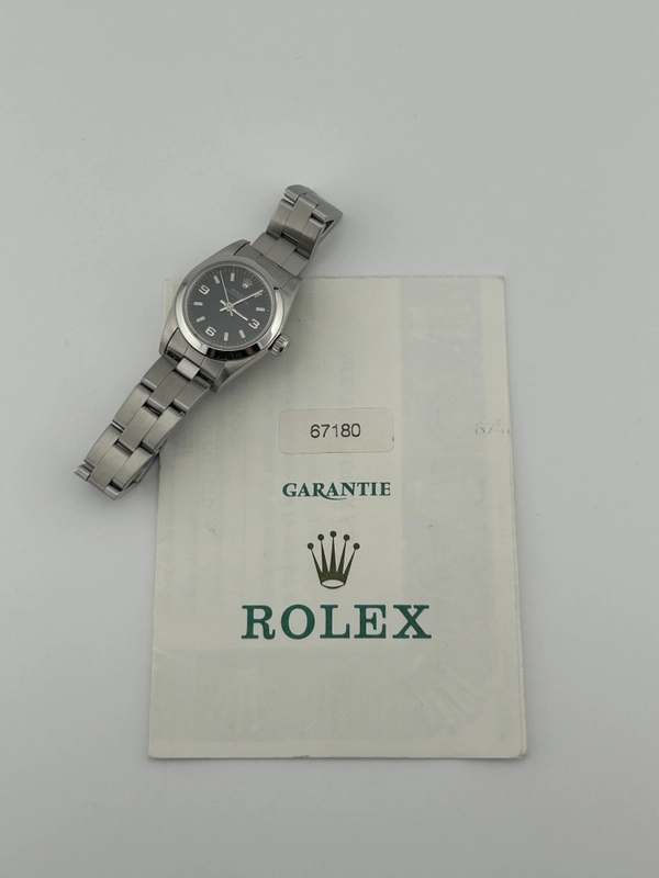Rolex Oyster Perpetual Black Dial on Oyster Steel Bracelet Ref. 67180 Papers 1997 view 8