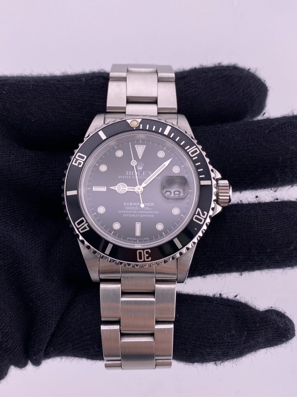 Rolex Submariner Black Dial on Oyster Ref. 16610 Papers Open Date view 2